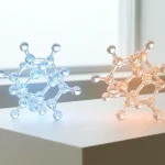 Molécules de CBD et de THC côte à côte en rendu 3D pour comparaison, sur fond clair